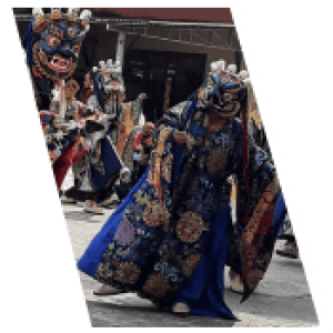 Cultural offbeat travel experience with Maruti Holidays, showcasing traditional masked dancers in vibrant costumes.